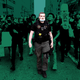 A Detroit police officer walks through demonstrators during protests on May 29, 2020. The badge on his chest, depicting Frank Castle’s Punisher skull on a green field alongside the words “Detroit Police,” is one of several designs using the imagery spotted on Detroit PD officers during recent protests.
